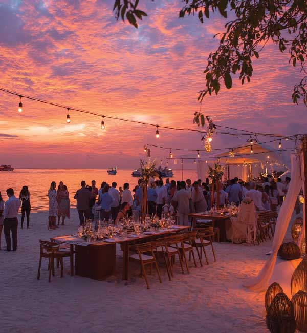 Guests at a sunset beach soirée